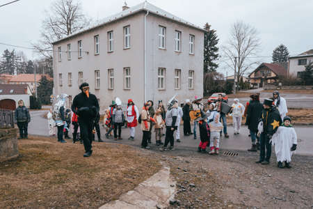 PUKLICE, CZECH REPUBLIC - MARCH 2, 2019: People attend the Slavic Carnival Masopust, a traditional ceremonial door-to-door procession in small village. January 13, 2016 in Puklice, Czech Republicのeditorial素材