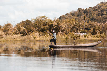 MAROANTSETRA, MADAGASCAR OCTOBER: 19.2016: Native malagasy man fishing on river, using technique...
