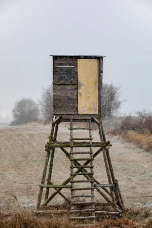 Wooden Hunters hunting tower in winter with snowfall, countryside landscape, Czech Republic, European Sceneryの写真素材
