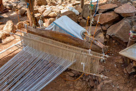 Hand loom in Konso village, karat Ethiopia. Craftsmanship background. Detail of traditional vintage weaving hand loom.の写真素材