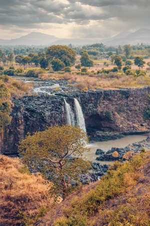 Blue Nile Falls in dry season with evenin dramatic sky. Ethiopia wilderness, Amhara Region, near Bahir Dar and Lake Tanaの写真素材