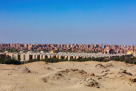 View of the panorama Cairo city skyline from Pyramids in the Giza Plateau, Egypt