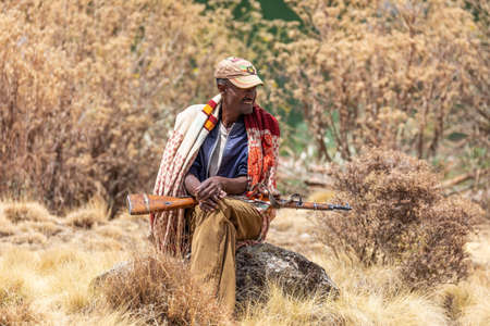 SIMIEN MOUNTAIN, ETHIOPIA, APRIL 24th 2019, Unidentified park scout with his rifle in National park...