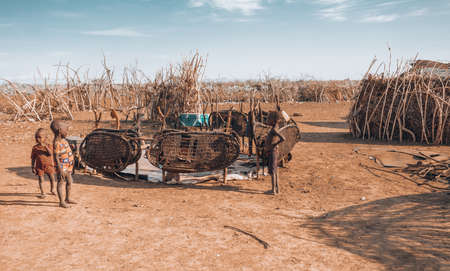 Omorate, Omo Valley, Ethiopia - May 11, 2019: Children from the African tribe Dasanesh in village. Daasanach are Cushitic ethnic group inhabiting in Ethiopia, Kenya, and South Sudanのeditorial素材