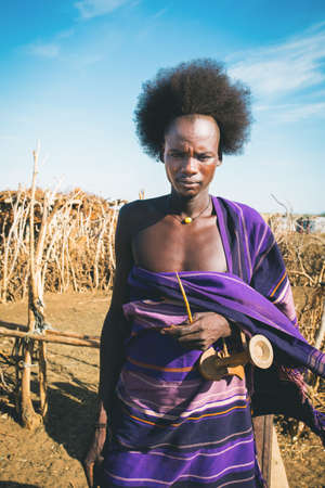 Omorate, Omo Valley, Ethiopia - May 11, 2019: Portrait of man from the African tribe Dasanesh. Daasanach are Cushitic ethnic group inhabiting in Ethiopia, Kenya, and South Sudanのeditorial素材