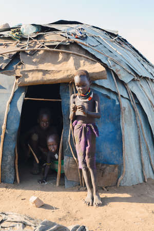 Omorate, Omo Valley, Ethiopia - May 11, 2019: Children from the African tribe Dasanesh in hut. Daasanach are Cushitic ethnic group inhabiting in Ethiopia, Kenya, and South Sudanのeditorial素材
