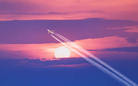 Passenger plane - airliner passes near the sun. Explore new frontier. Space traveler conceptの写真素材