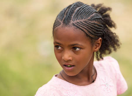 Adi Abbaghie, Ethiopia - April 28, 2019: Ethiopian beautiful girl with traditional braided hair...