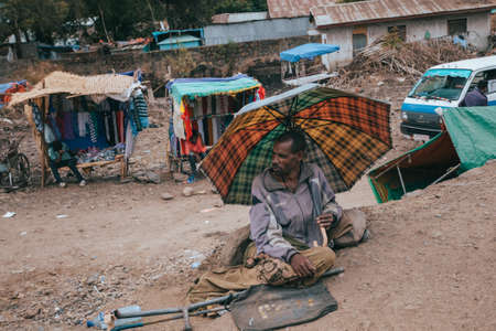 AZEZO, ETHIOPIA, APRIL 22th. 2019, Beggar on the street in city Azezo. April 22th. 2019, AZEZO, Ethiopiaのeditorial素材