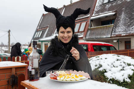 PUKLICE, CZECH REPUBLIC - FEBRUARY 29, 2020: Peoples in mask attend Masopust or the Mardi Gras carnival, traditional ceremonial door-to-door procession. February 29, 2020 in Puklice, Czech Republicのeditorial素材