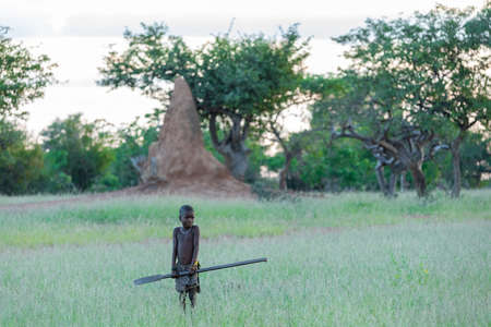 NAMIBIA, OMUSATI REGION, MAY 7: The Himba boy in early cold morning in grassland. The Himba are...