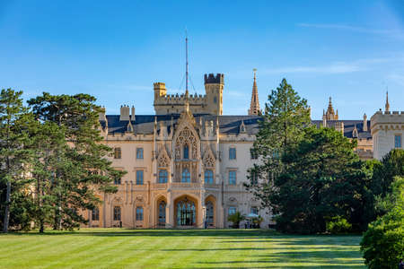 Lednice Chateau with beautiful gardens with flowers and parks on a sunny summer day. Lednice-Valtice landmark, South Moravian region. UNESCO World Heritage Site. Czech Republicのeditorial素材