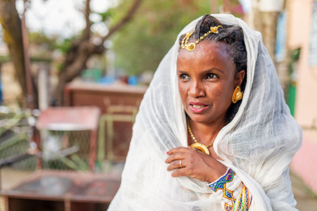 Mekelle, Ethiopia - April 28, 2019: Ethiopian beautiful woman with traditional costume on the street in Mekelle, second largest city and capital of Tigray region, in Ethiopia Africaのeditorial素材