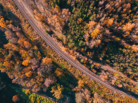 Aerial view of autumn countryside with railway, traditional fall landscape from bird eye. Czech Republic, Vysocina highland, Central Europeの写真素材