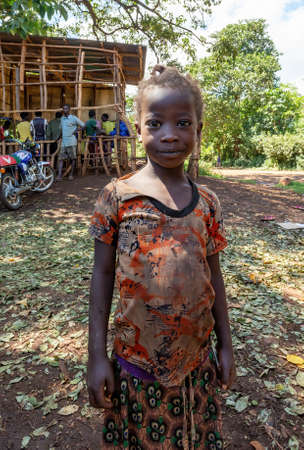 Cure - Jinka, Omo River Valley, Ethiopia - May 10, 2019: portrait of happy teenage girl with tangled...