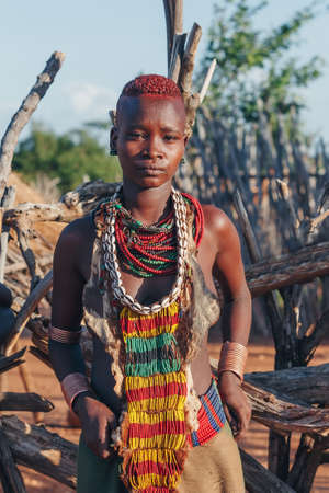 Turmi, Omo River Valley, Ethiopia - May 10, 2019: Portrait of a beautiful woman in Hamar village. Hamars are the original tribe in southwestern Ethiopia. South Ethiopia Africaのeditorial素材