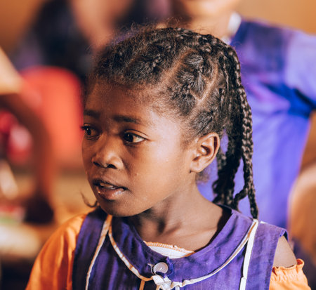 Vohitsaoka, Ambalavao, Madagascar - November 17, 2022: Happy Malagasy school girl, students in classroom. School attendance is compulsory, but many children do not go to school.のeditorial素材