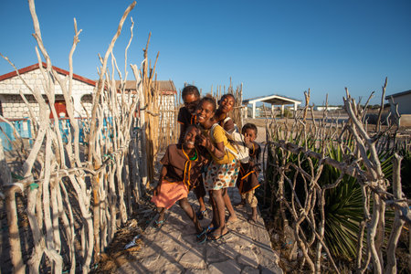 Anakao, Madagascar - November 21, 2022 - Group of Malagasy children frolicking on the beach near the fishing village of Anakao.のeditorial素材