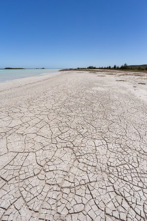 Stunning view of Tsimanampetsotsa Lake with dry, cracked beach and surrounding landscape with blue sky. Madagascar wilderness landscapeの写真素材
