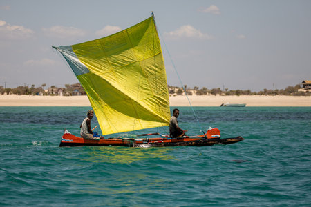 NOSY ISLAND, MADAGASCAR - NOVEMBER 22, 2022: Fishermen using sailboats to fish off the coast of Nosy Island in Madagascar. The primary source of livelihood in Anakao is fishing.のeditorial素材