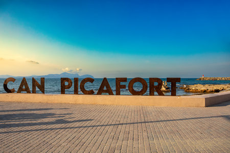 Signpost on promenade. Can Picafort Beach, evening with no people, Balearic Islands Mallorca Spain. Travel agency vacation concept.の写真素材