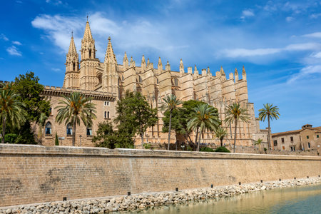 Gothic medieval cathedral La Seu and Royal Palace of La Almudaina. Capital city of Palma de Mallorca. Balearic Islands Spain. Travel agency vacation concept.のeditorial素材