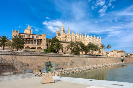 Gothic medieval cathedral La Seu and Royal Palace of La Almudaina. Capital city of Palma de Mallorca. Balearic Islands Spain. Travel agency vacation concept.のeditorial素材