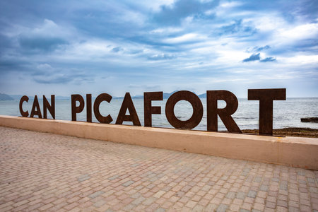 Signpost on promenade. Can Picafort Beach, evening with no people, Balearic Islands Mallorca Spain. Travel agency vacation concept.の写真素材