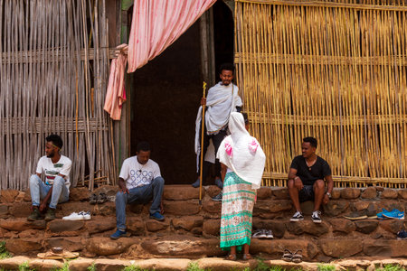 Lake Tana, Ethiopia - April 21st, 2019: Pilgrims and worshipers in front of the ancient monastery of Ura Kidane Mihret, showcasing the religious devotion and cultural significance of the site.のeditorial素材