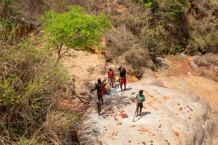 Dabalava, Madagascar - November 1, 2022: Local people mine for gems and pan for gold in a river. If they're lucky, they'll find a little gold flakeのeditorial素材