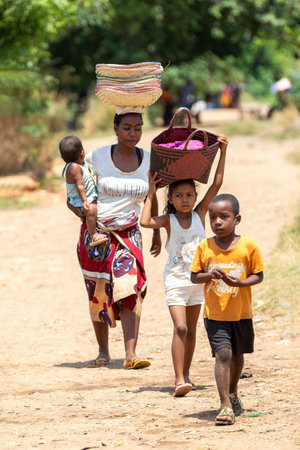 Miandrivazo, Madagascar - November 2nd, 2022: A group of Malagasy people on the streets of Miandrivazo.のeditorial素材