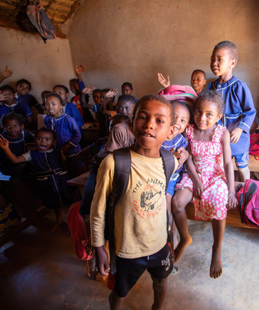 Vohitsaoka, Ambalavao, Madagascar - November 17, 2022: Happy Malagasy school children students in classroom. School attendance is compulsory, but many children do not go to school.のeditorial素材