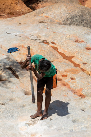 Dabalava, Madagascar - November 1, 2022: Local people mine for gems and pan for gold in a river. If they're lucky, they'll find a little gold flakeのeditorial素材