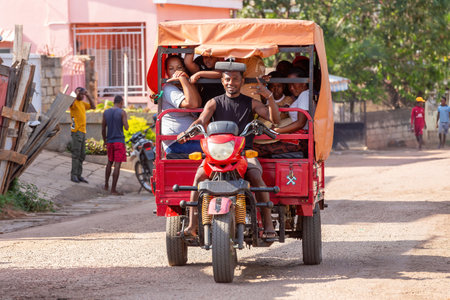 Miandrivazo, Madagascar - November 2nd 2022: Rarely seen motor rickshaw on the city streets, serving as a cultural emblem and a mode of transport.のeditorial素材