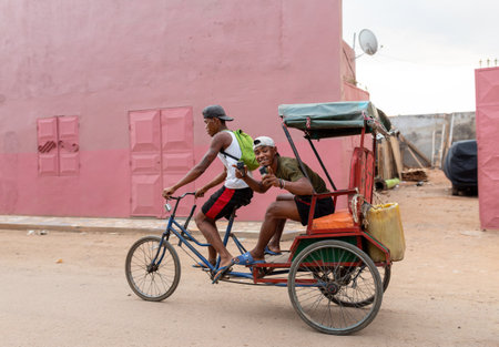 Miandrivazo, Madagascar - November 2nd 2022: A traditional rickshaw on the city streets, serving as a cultural emblem and a mode of transport.のeditorial素材
