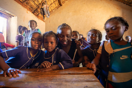Vohitsaoka, Ambalavao, Madagascar - November 17, 2022: Happy Malagasy school children students in classroom. School attendance is compulsory, but many children do not go to school.のeditorial素材