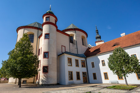 Gothic medieval church, Piarist Church of the Finding of the Holy Cross at sunny summer day, Monastery Garden, Litomysl, Czech Republicの写真素材