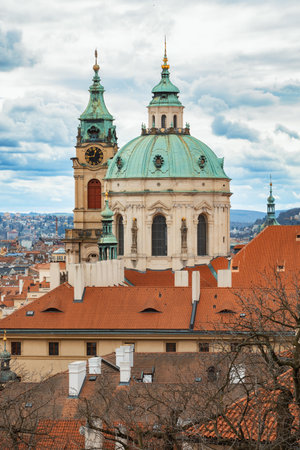 Panorama of old historic town Prague in Czech Prague, view from castle hill in sunny day, in front Church of Saint Nicholas. Central Bohemia, Czech Republicの写真素材