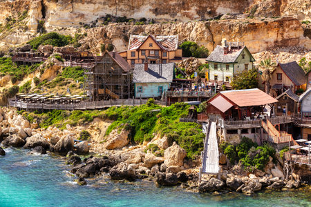Whimsical Popeye Village in Malta, a film set turned attraction, with its quirky architecture and waterfront charm.の写真素材