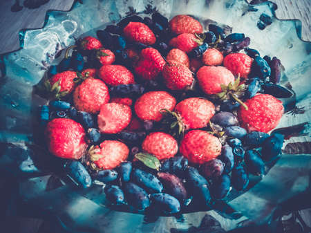 strawberries and honeysuckleの写真素材