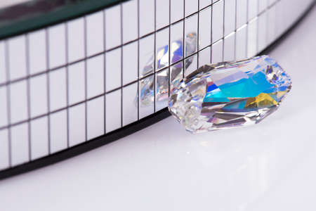 Gemstone reflective mirror on a white background.の写真素材