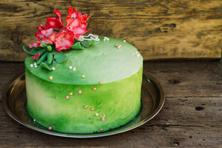 cake with flowers on a wooden background