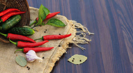 red pepper with leaves on sacking closeupの写真素材