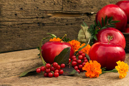 apples on a wooden background blurred with applesの写真素材