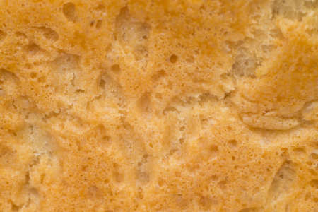 abstract texture of bread crust photographed closeupの写真素材
