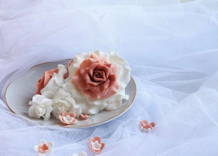 Rose sugar lie on a plate on veilの写真素材