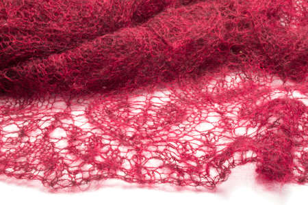 Knitting openwork fabric on a white background