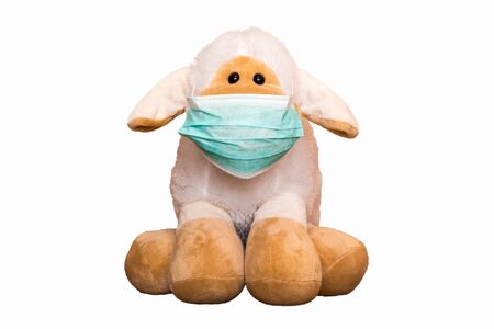 Cute Sheep Plush Toy with Mask isolated on white backgroundの写真素材