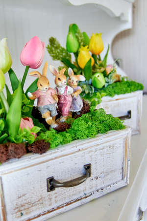 Artificial flower decoration on white furnitureの写真素材