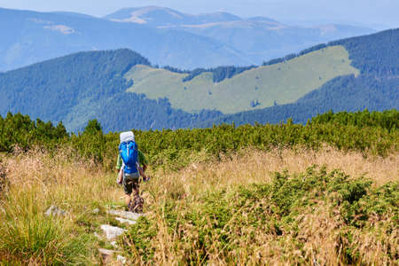 Unidentified Father carrying daughter on the Retezat Mountains, Romaniaの写真素材